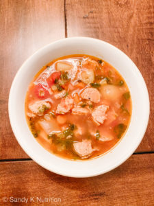 Tomato Vegetable Sausage Soup on a bowl