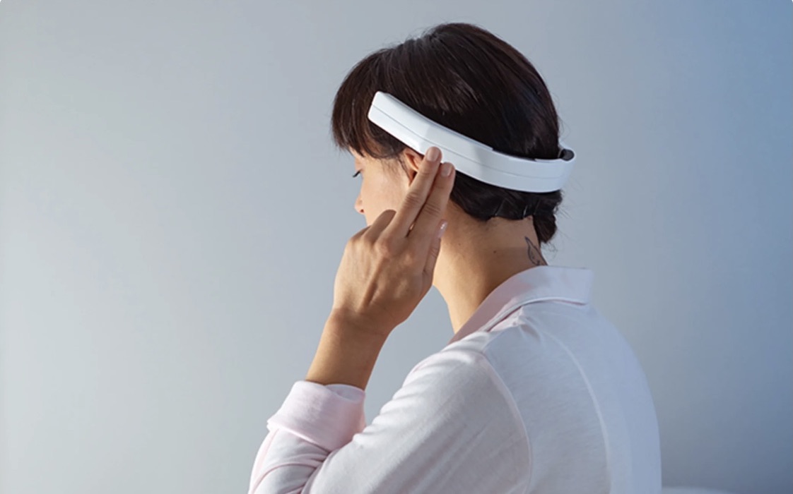 Woman wearing a head gear and pointing fingers